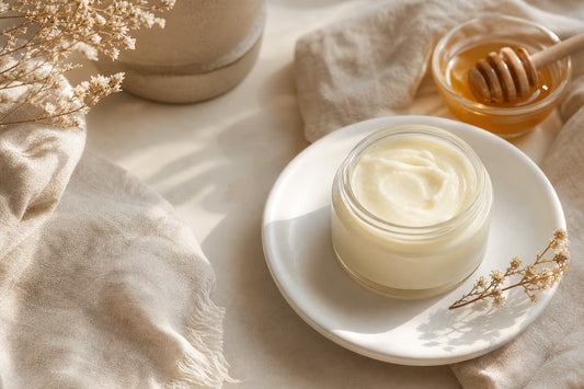 Minimal natural skincare scene with beef tallow balm jar and honey accent