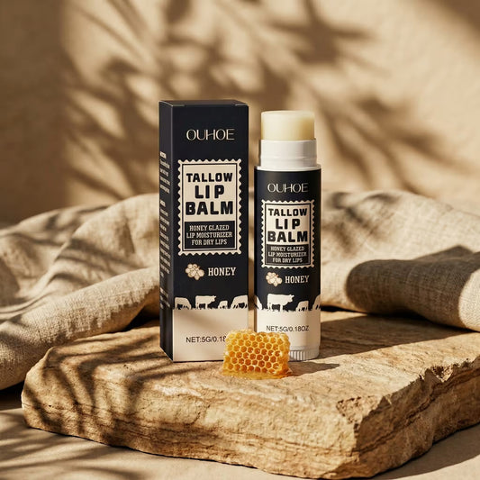 OUHOE tallow lip balm with packaging on a wooden surface with honeycomb