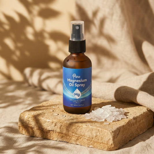 Bottle of Pure Magnesium Oil Spray on a stone surface with a natural background