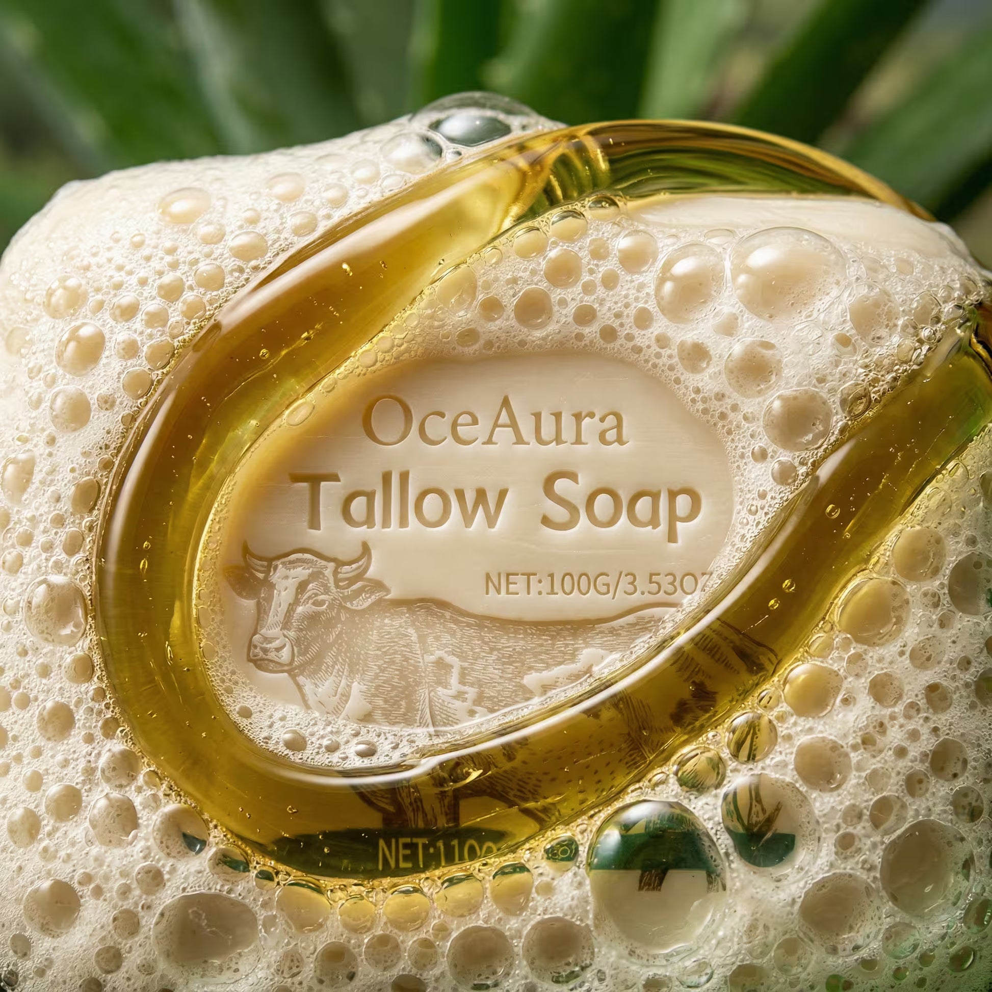 Grass-fed tallow soap bar with creamy lather, labeled "OceAura Tallow Soap," 100g.